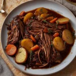 Delicious apple cider braised brisket served with vegetables