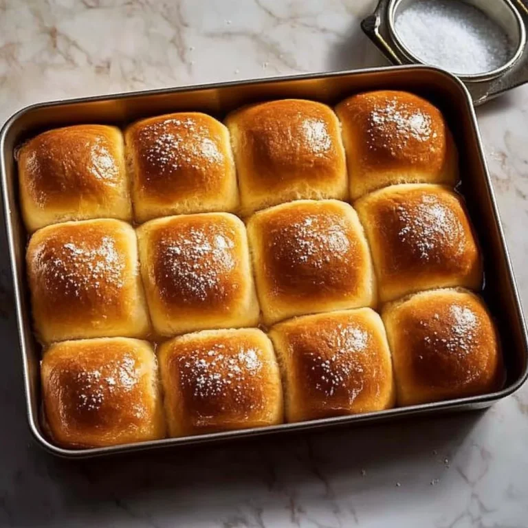Freshly baked Thanksgiving Rolls on a rustic wooden table