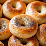 High protein Greek yogurt bagels fresh out of the oven, topped with seeds.