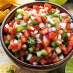 Jar of Rooster's Beak Salsa with fresh ingredients