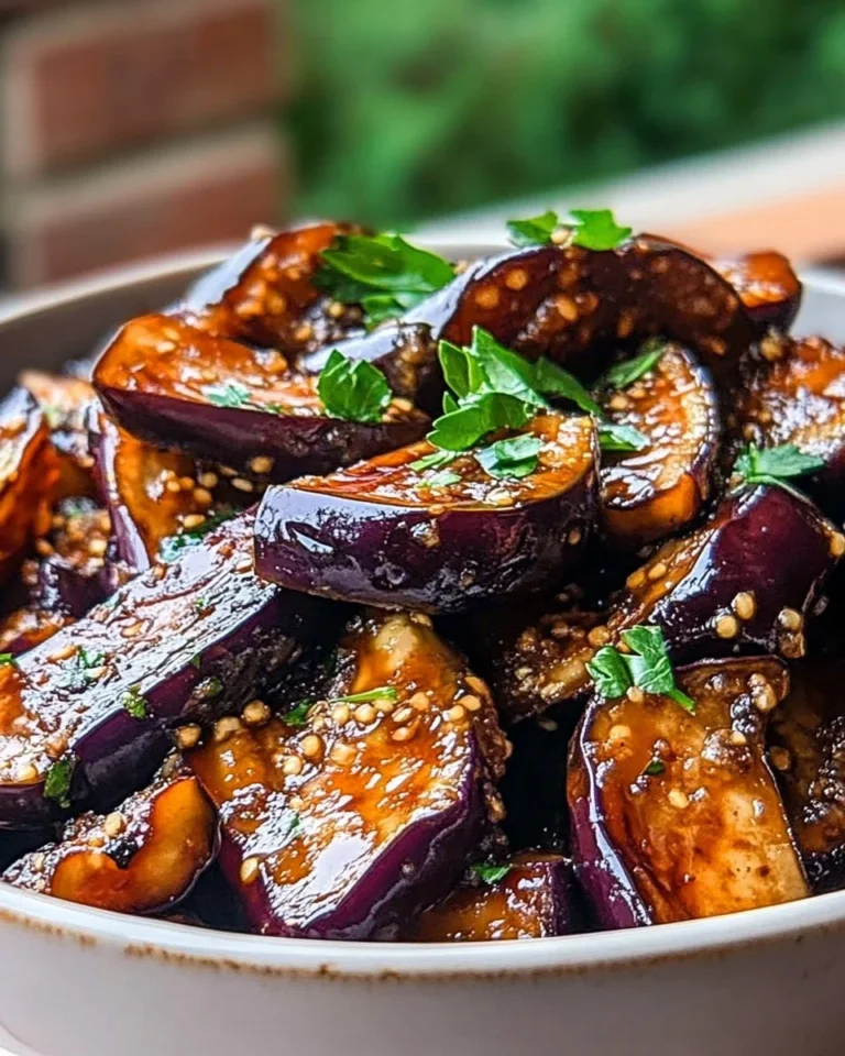 Savory garlic eggplant dish garnished with herbs and spices