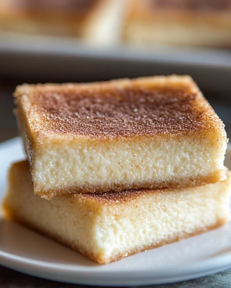 Sopapilla Cheesecake Bars with cinnamon-sugar topping