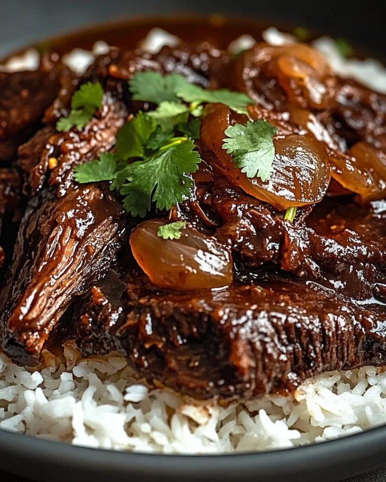 Delicious sweet and savory caramelized pulled beef served in a bowl