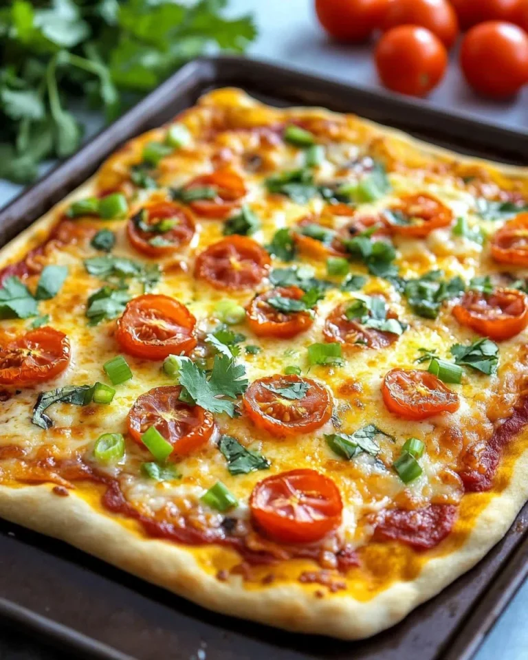 Taco Pizza made with Crescent Rolls topped with cheese, lettuce, and salsa