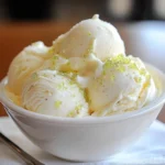A delicious bowl of Easy Homemade Key Lime Pie Ice Cream garnished with lime slices.