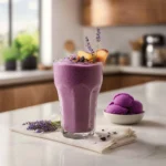Whimsical purple sweet potato smoothie with lavender infusion in a glass